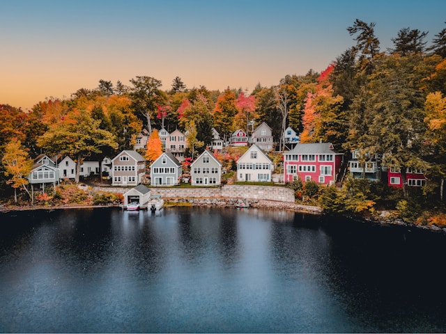 Lakefront homes on Lake Winnipesaukee NH in fall foliage season