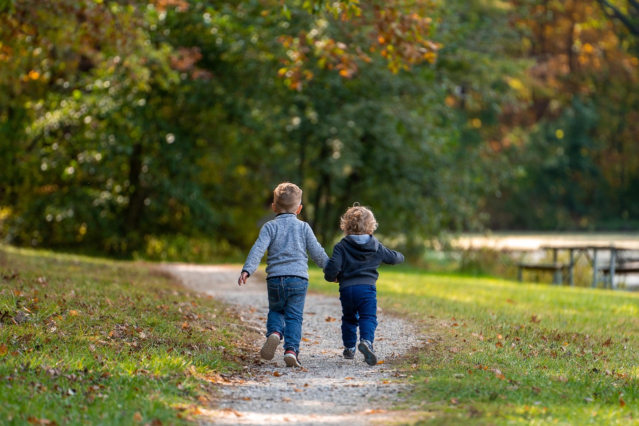 Children walking along a city park trail
